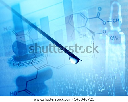 Close-up of syringe needle with drop and research background.