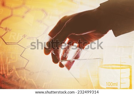 Laboratory glass in arm. Laboratory concept.