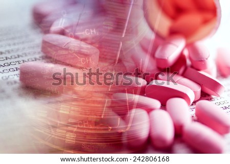 Pills scattered on paper and DNA data. Small depth of field.