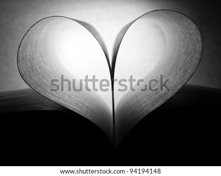 Sheets of a book heart shaped. Black and white style.