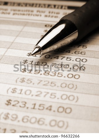 Finance background with pen and finance data