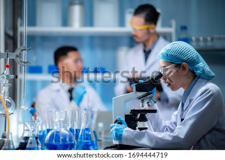 Similar – Image, Stock Photo Scientist working in corona virus vaccine development laboratory research facility.