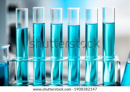 Chemistry laboratory glassware, science laboratory research and development concept, flask, beaker, and test tubes with blue liquid water sample test, scientific test tubes equipment Foto stock © 