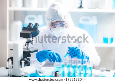 Health care researchers working in life science laboratory, medical science technology research work for test a vaccine, coronavirus covid-19 vaccine protection cure treatment