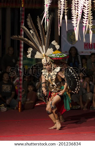 DENPASAR, BALI, INDONESIA - JUNE 14: Unidentified dancer from the indigenous Borneo people performs a traditional Borneo dance at Bali Art Festival on June 14, 2014 in Denpasar, Indonesia
