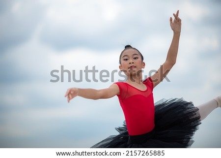 Similar – Image, Stock Photo Woman performing handstand while practicing yoga on street