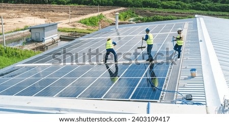 Similar – Image, Stock Photo Man cleaning solar panel on roof. Solar panel or photovoltaic module maintenance. Sustainable resource and renewable energy for go green concept.  Solar power for green energy. Technology for future.