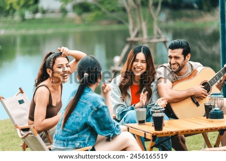Similar – Image, Stock Photo Young friends sharing a cannabis joint during sunny day on the city.