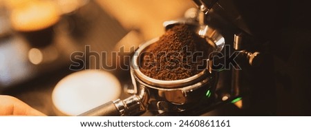 Similar – Image, Stock Photo Barista preparing a coffee at the sieve carrier machine in a café