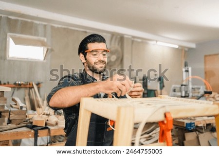 Similar – Image, Stock Photo Professional carpenter at work, he is carving wood using a woodworking tool, hands close up, carpentry and craftsmanship concept