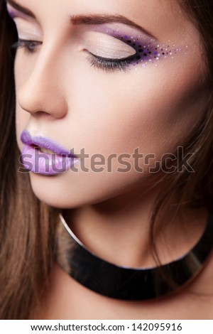 portrait of sexy woman with violet makeup and violet chubby lips