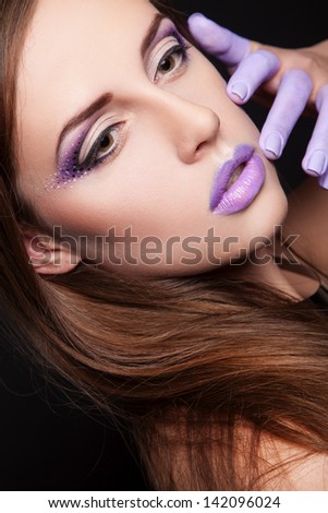 portrait of sexy woman with violet makeup and violet chubby lips