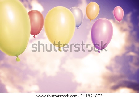 Vintage balloons over sky