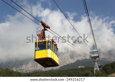 The cable car in Crimea Ai-Petri on a background of mountains covered with clouds