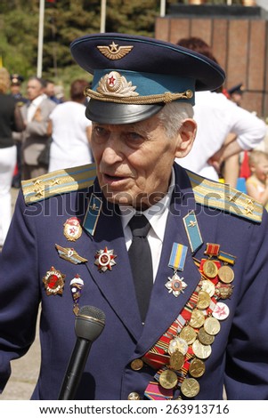 SLAVIANSK, UKRAINE - MAY 9, 2012: Unidentified Soviet Army veteran of World War II on Victory day in Slaviansk on May 9, 2012. Veteran reminisces about the past, in an interview