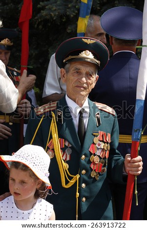 SLAVIANSK, UKRAINE - MAY 9, 2012: Unidentified Soviet Army veteran of World War II on celebration of Victory day in Slaviansk, Ukraine, May 9, 2012