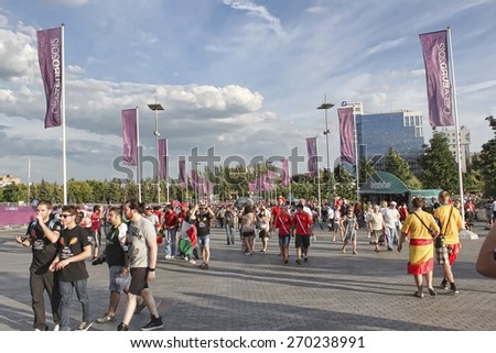 DONETSK, UKRAINE - JUNE 27, 2012: Fans gather for soccer semifinal match of Euro 2012 Spain vs. Portugal in Donetsk Donbass Arena. Spain won by penalties and then won final match