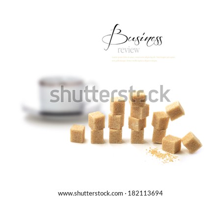 Unusual and different concept image for a business review or a sales meeting. Brown sugar cubes represent a sales graph and falling sales. Copy space.