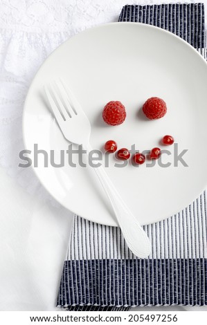 Concept image for happy food. Fresh fruit arranged into a smiling face. Copy space.