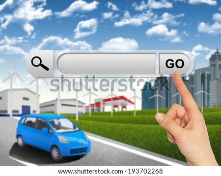 Human hand indicates the search bar in browser. Urban landscape as backdrop