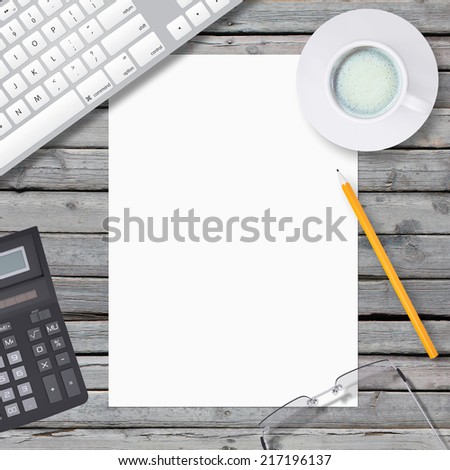 Lie on wooden floor keyboard and empty paper sheet