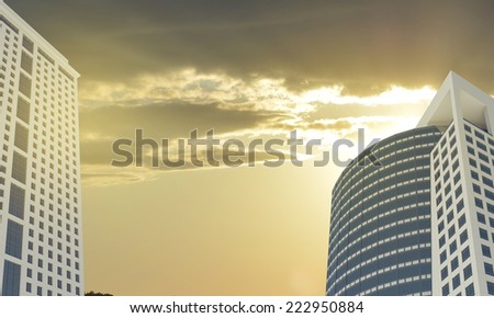 Skyscrapers and evening sky with clouds. Architecture background