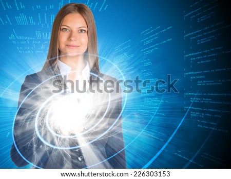 Businesswoman pointing her finger on glowing spiral. Text rows as backdrop