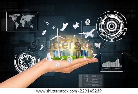 Hand holds city of skyscrapers on green grass and businessman walking forward. Flying letters near hand. Business concept