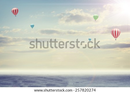 Concrete floor on background of clouds and sun with hot air balloon