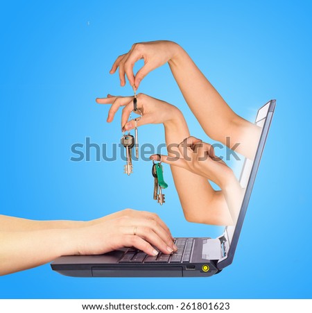 Keys holding in fingers from monitor screen. Hands typing on keyboard. Blue background