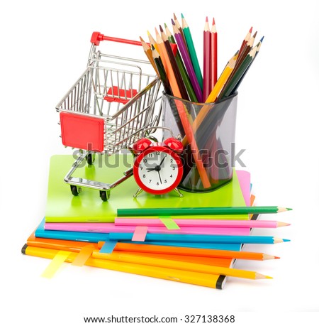 Pencil cup with crayons and alarm clock, shopping cart on isolated white background