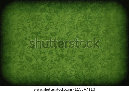 Green dark wall with old floral pattern background or texture