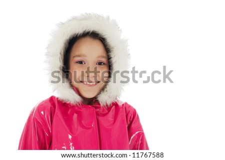 Young girl smiling in a pink raincoat with woolly hood