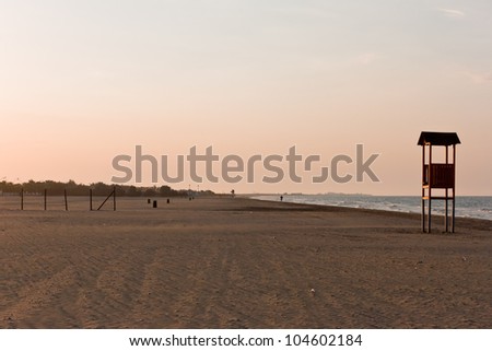 beach on the coast of the Puglia to the sunset
