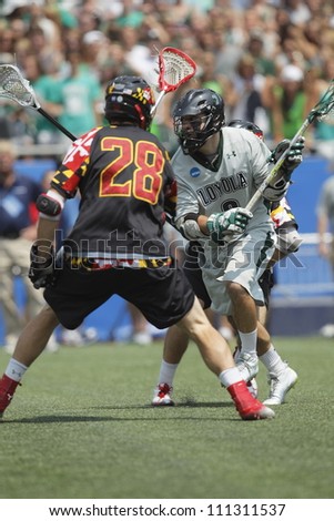 FOXBOROUGH - 28 MAY: Chris Layne (3), Loyola University Maryland, prepares for a shot on goal against Maryland, College Park at the NCAA Men\'s Division 1 Lacrosse Championship game, 28 May 2012 in Foxborough, Massachusetts