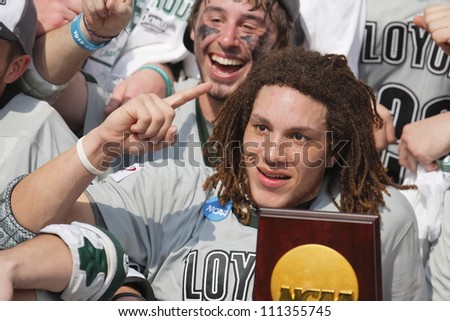 FOXBOROUGH - 28 MAY: Josh Hawkins (5) with the championship trophy in Loyola\'s win over Maryland 9-3 at the NCAA Men\'s Division 1 Lacrosse Championship game in Foxborough, Massachusetts, 28 May 2012.