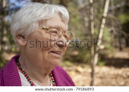 Happy outdoor senior woman portrait