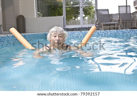 Senior woman aqua fitness