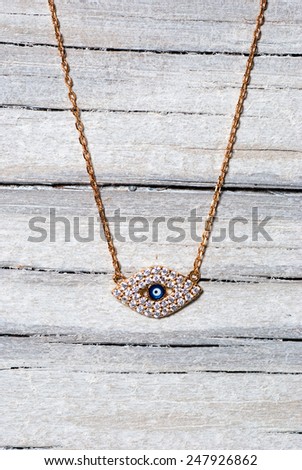 Necklace on old wooden table