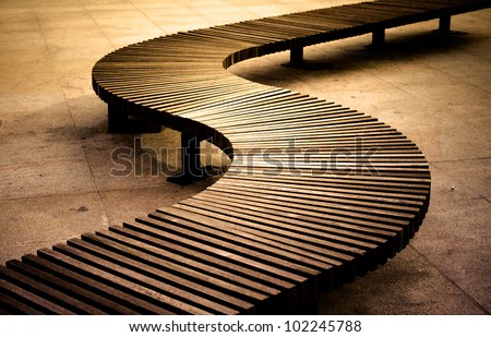Curved wooden boarded bench