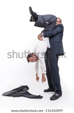 Big Man Holding Another Upside Down By The Ankles Stock Photo 116342899 ...