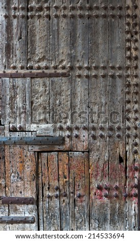 Ancient wooden door with wood studs