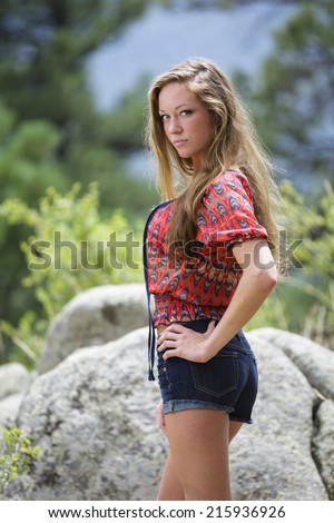 Young teen model with long brown hair and western wear