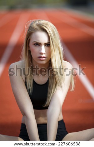 Portrait of a young athletic woman with a determine facial expression