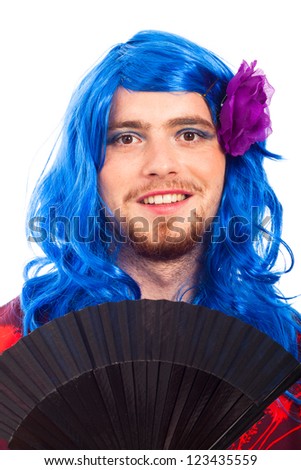 Happy transvestite man cross dressing in blue wig, isolated on white background.