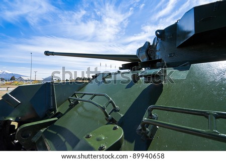 Military green tank with a blue cloudy sky. National Army Museum, Waiouru, New Zealand.