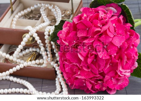 pink hortensia flowers and open jewel box close up