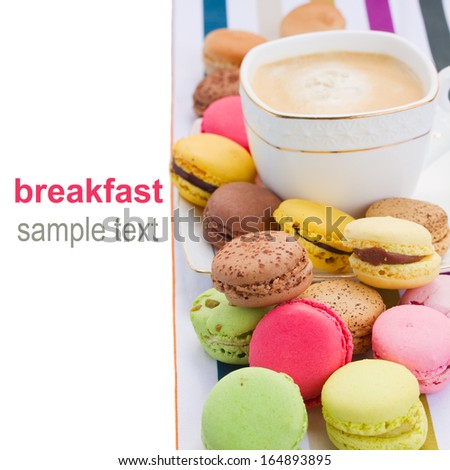pile  of  macaroons  and coffee as a border isolated on white background