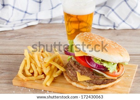 Fresh  burger with french fries and beer