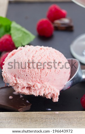scoop of pink berry icecream close up
